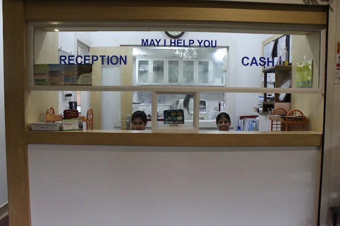 Reception and cash counter with the sign "May I help you"
